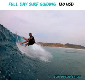 "A surfer charging down a powerful wave with the guidance of an expert surf instructor in Salina Cruz, Oaxaca. The private session offers a thrilling opportunity to tackle world-class waves and sharpen surf skills in a stunning, remote location."